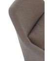 sillón tapizado color taupe con cojín  patas metálicas negras